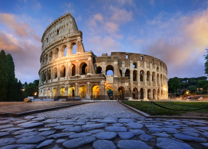 View of Colosseum in Rome and morning sun, Italy, Europe.